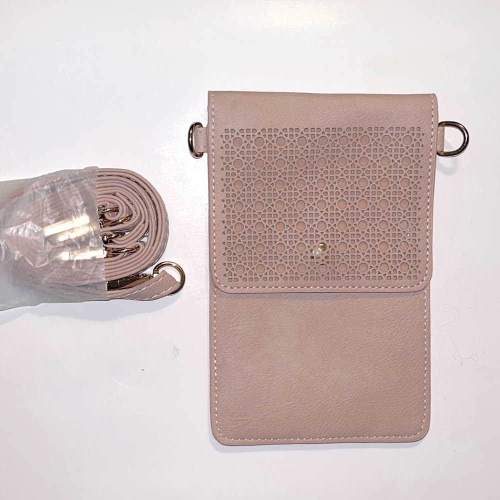 NWOT nude phone holder/wallet clutch. Comes with detachable cross body strap.